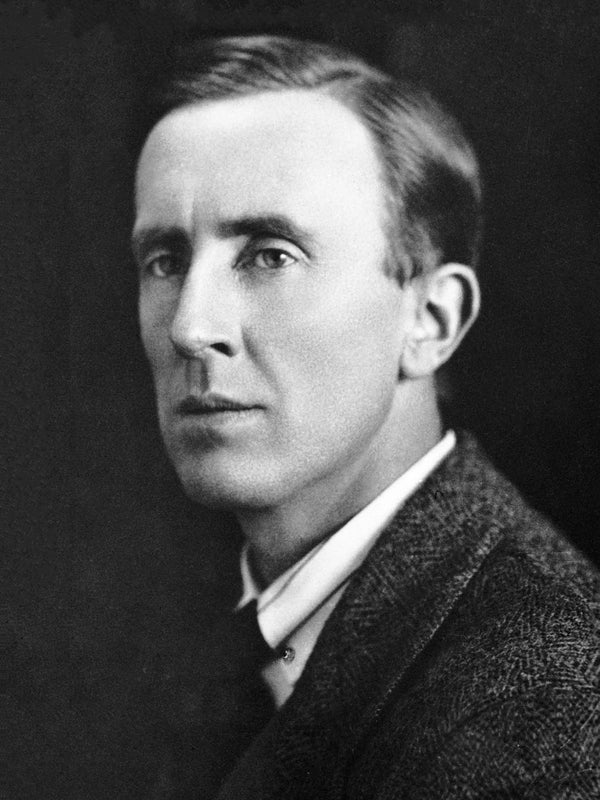 Black and white portrait of a man wearing a suit and tie.