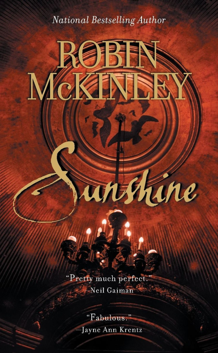 Book cover of 'Sunshine' by Robin McKinley with a dark red background and gold text.