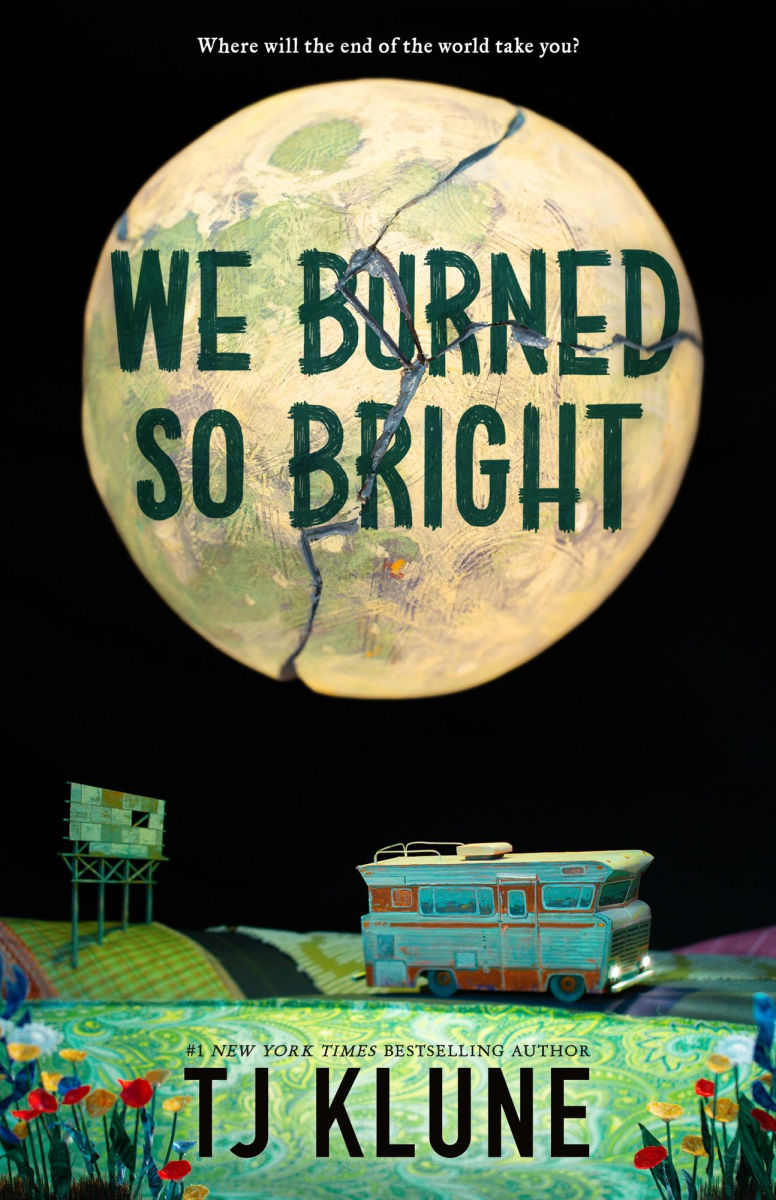 Book cover of 'We Burned So Bright' by TJ Klune with a stylized Earth and small building.