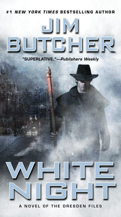 Book cover of 'White Night' by Jim Butcher featuring a character holding a staff in a misty, urban setting.